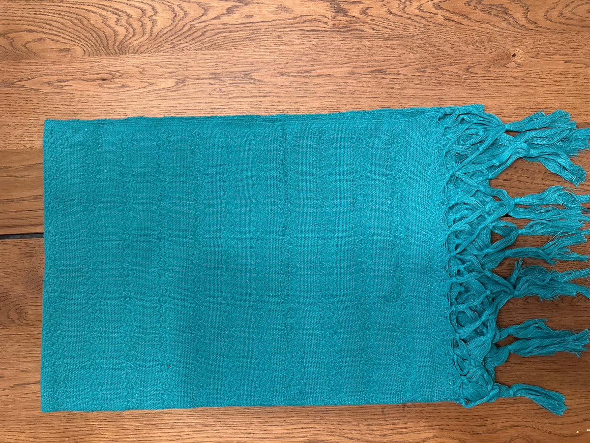 Jade Maya handwoven Mexican cotton rebozo flat lay in solid deep teal with teal fringe | Lola My Love
