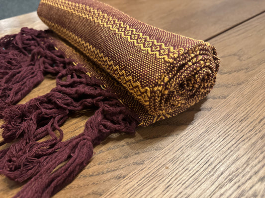 Mole Dorado handwoven Mexican cotton rebozo in deep burgundy with golden-yellow diamond stripes
