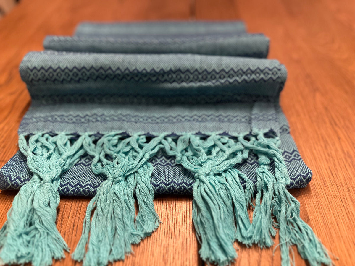 Agua de Mar turquoise cotton rebozo shawl folded in layers with navy diamond stripes and aqua fringe | Lola My Love