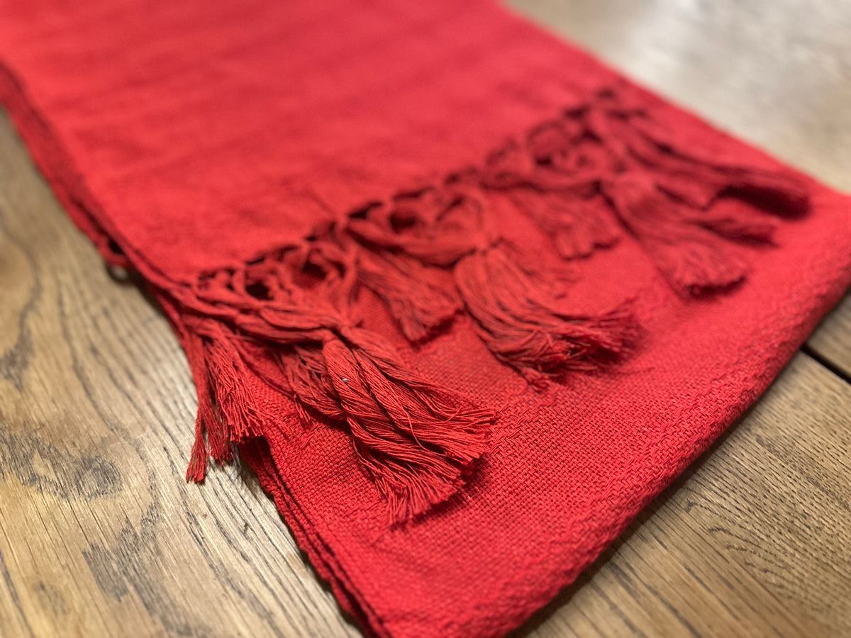 Close-up of the Chile Rojo rebozo's red hand-knotted fringe and woven border | Lola My Love