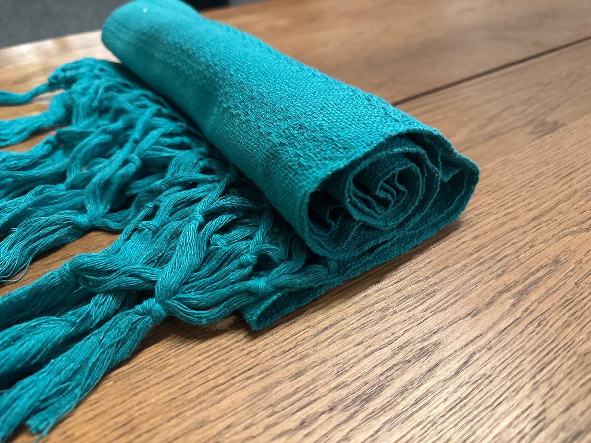 Rolled Jade Maya handwoven Mexican cotton rebozo in solid deep teal jade green with matching teal knotted fringe | Lola My Love