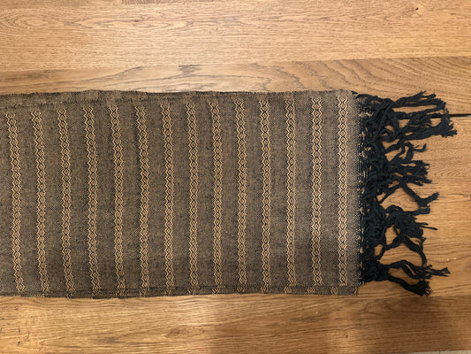 Noche de Mezcal handwoven Mexican cotton rebozo flat lay — black base with golden-tan diamond-zigzag stripes and black knotted fringe | Lola My Love