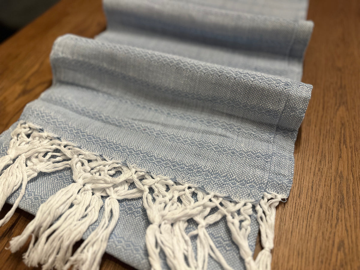 Talavera Azul sky blue cotton rebozo shawl folded in layers with white diamond stripes and white fringe | Lola My Love