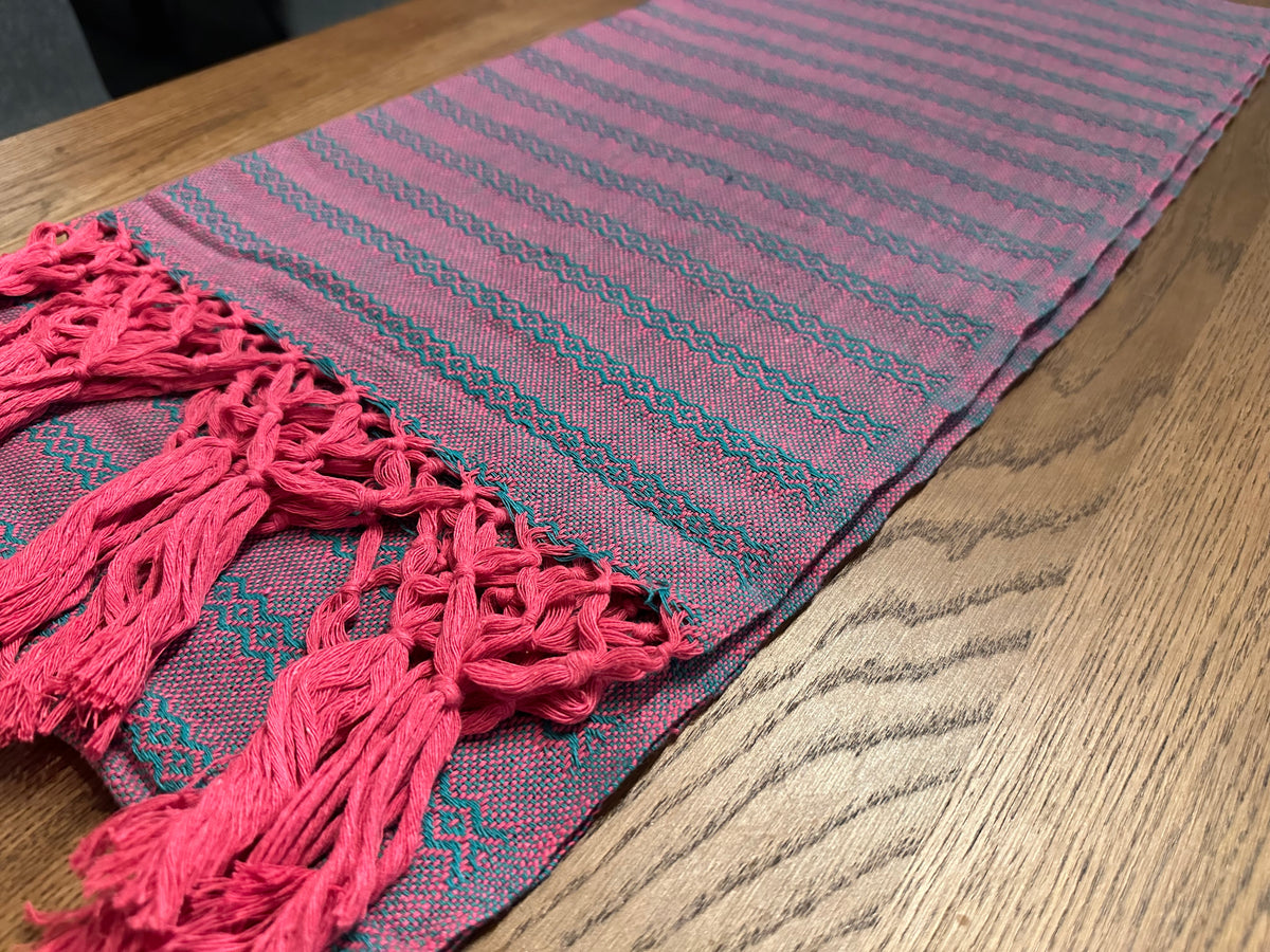Close-up of the Tuna Rosa rebozo's teal / jade diamond stripes and bright pink hand-knotted fringe | Lola My Love