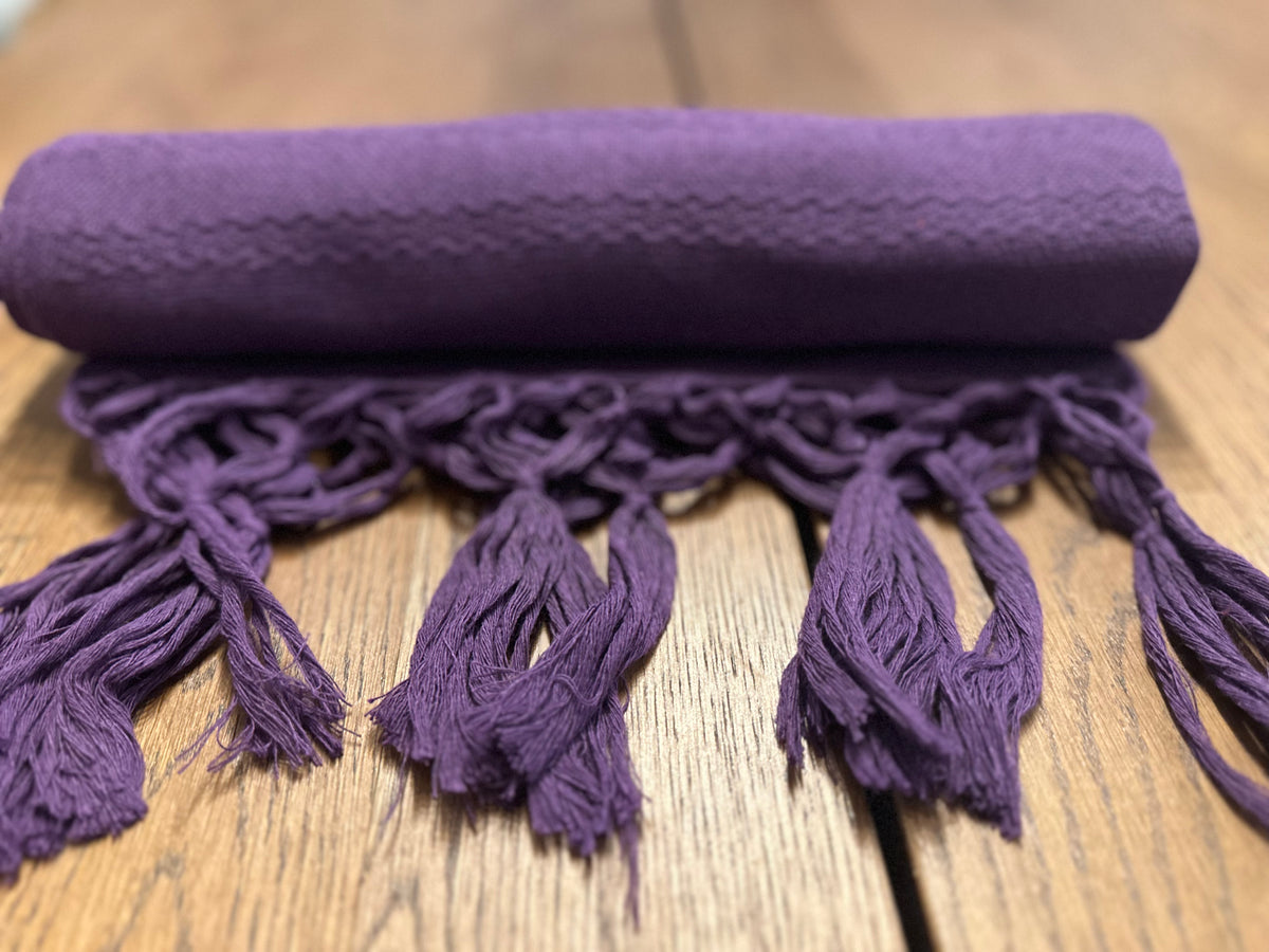 Uva Morada purple Mexican rebozo baby wrap rolled with knotted fringe in front | Lola My Love
